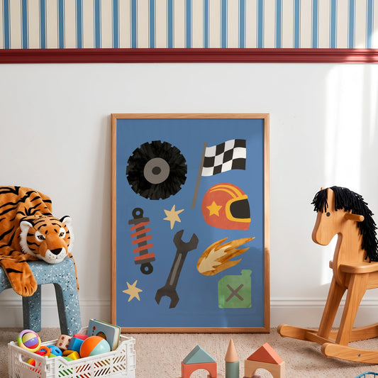 A framed children's wall art print featuring a blue background with racing-themed illustrations including a tire, checkered flag, helmet, wrench, flame, and fuel can, displayed in a styled nursery room next to a plush tiger and a wooden rocking horse.