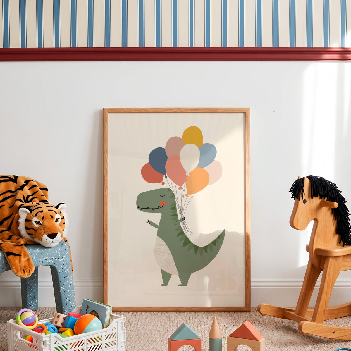 A framed children's art print featuring a green dinosaur holding colorful balloons, styled in a nursery or playroom setting with a tiger plush, wooden rocking horse, and toys on the floor.