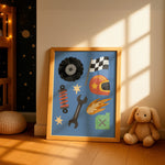 A framed art print featuring a blue background with various racing and workshop-themed illustrations, leaning against a beige wall on a wooden floor next to a teddy bear and a small rabbit toy.