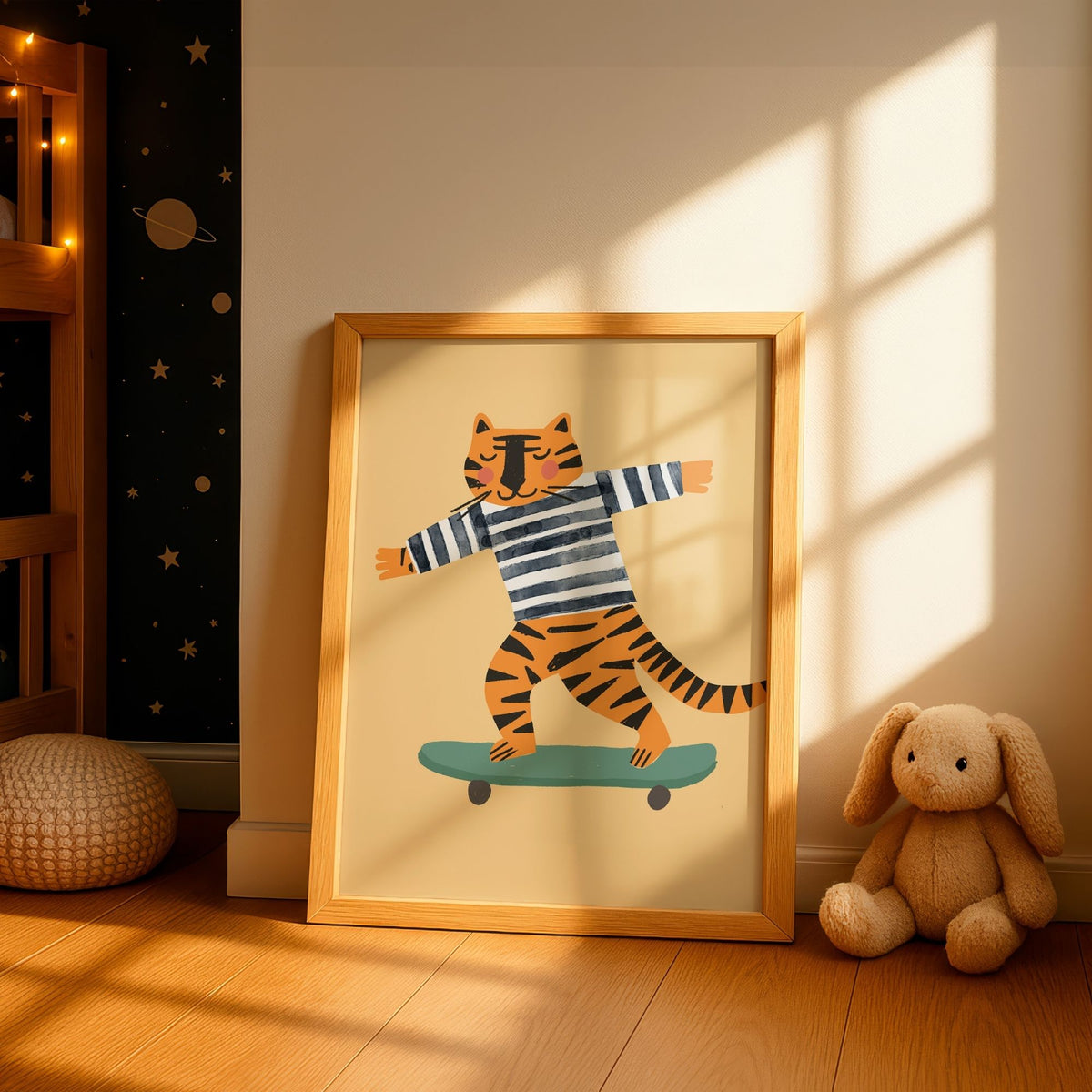 A framed children's art print featuring a cartoon tiger in a navy and white striped shirt balancing on a teal skateboard, leaning against a wall in a sunlit nursery next to a stuffed bunny.
