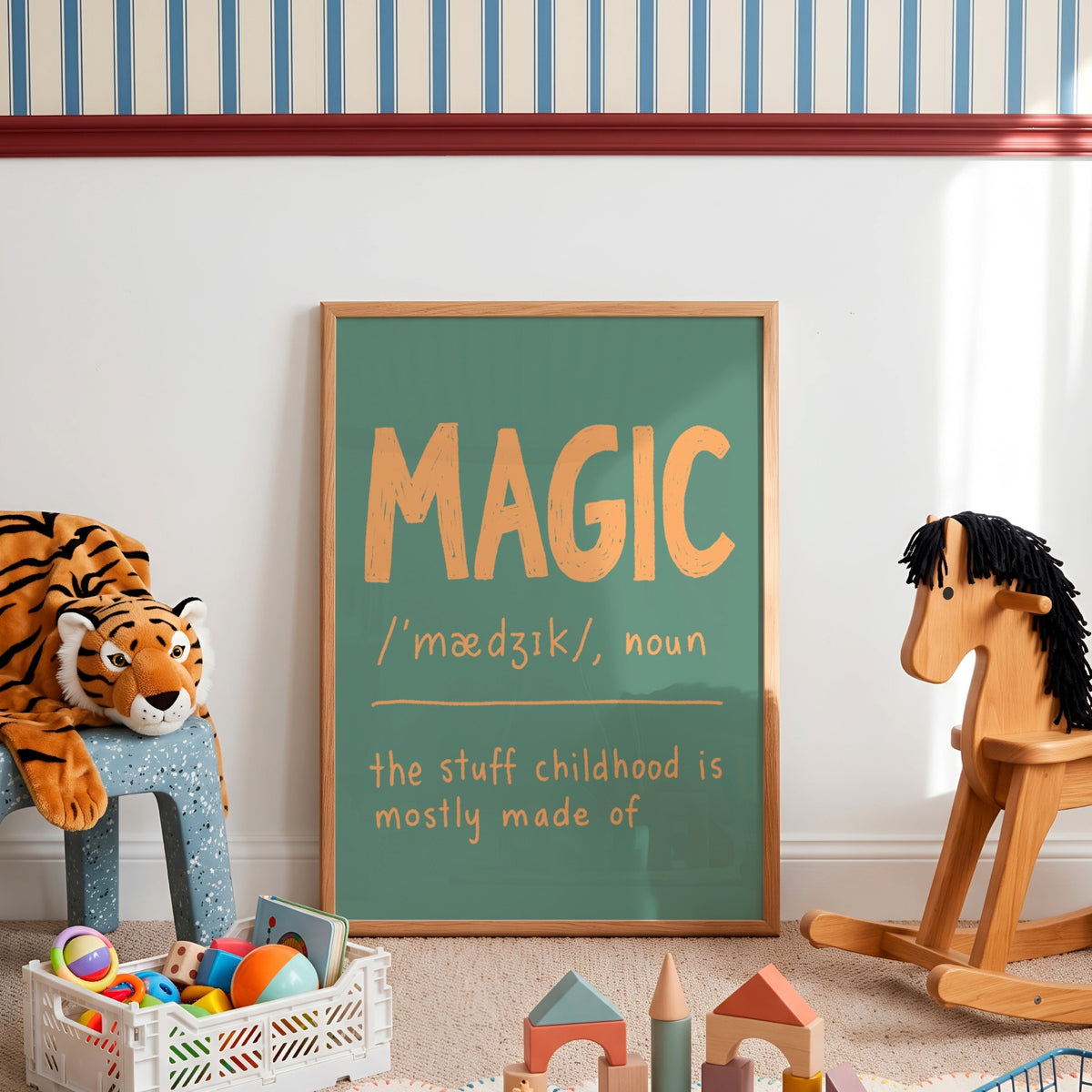 A framed chalkboard-style wall sign with the word “MAGIC” in large orange letters and a dictionary definition below, styled in a children’s room with a stuffed tiger, rocking horse, toys, and striped wallpaper.