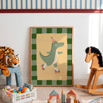 A framed children's art print featuring a green cartoon alligator roller skate, displayed in a styled nursery room with toys, a rocking horse, and a stuffed tiger.