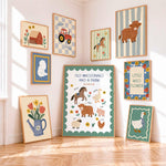 A styled interior scene showing multiple framed farm-themed art prints arranged on light walls above a wood floor. The central and most prominent print reads 'OLD MACDONALD HAD A FARM' with illustrations of animals and flowers, surrounded by other prints including a barn, tractor, horse, cow, tulips in a watering can, and a duck.