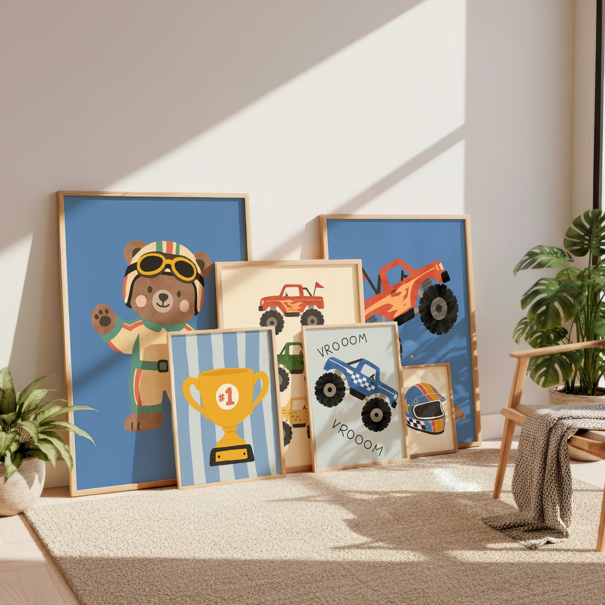 Framed monster truck kids prints leaning against wall, with racing bear, number one trophy, Vrooom truck and jumping flame truck