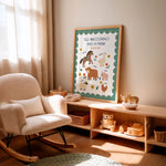 A framed children's art print with the text 'OLD MACDONALD HAD A FARM' and colorful farm illustrations, displayed on a light wood shelf in a softly lit nursery next to a cream rocking chair.