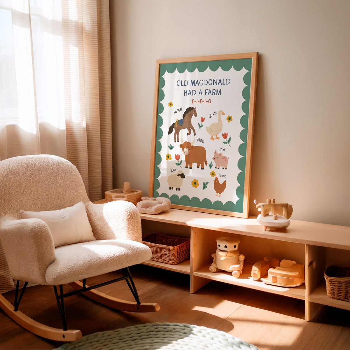 A framed children's art print with the text 'OLD MACDONALD HAD A FARM' and colorful farm illustrations, displayed on a light wood shelf in a softly lit nursery next to a cream rocking chair.