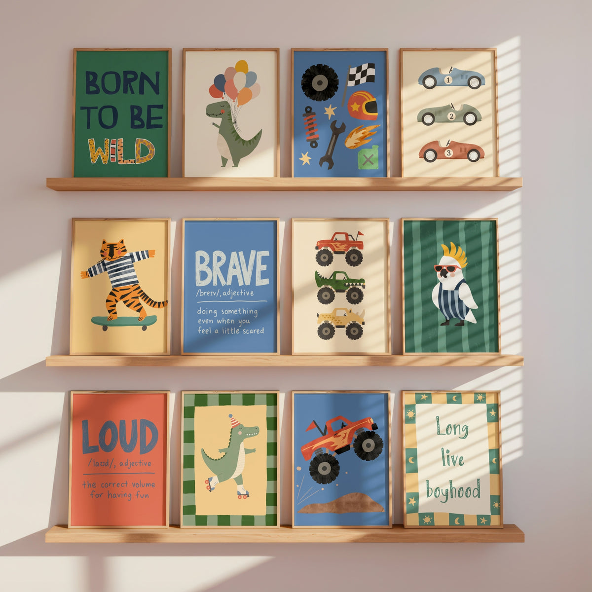 Three wooden wall shelves display a set of colorful children's art prints with motivational and nature-themed illustrations, including a dinosaur, racing cars, a tiger on a skateboard, a blue bird, and a green dinosaur.