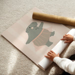 Framed Ballerina Hippo print styled in a nursery – hand-drawn ballerina hippo in a pink tutu on a candy-stripe background