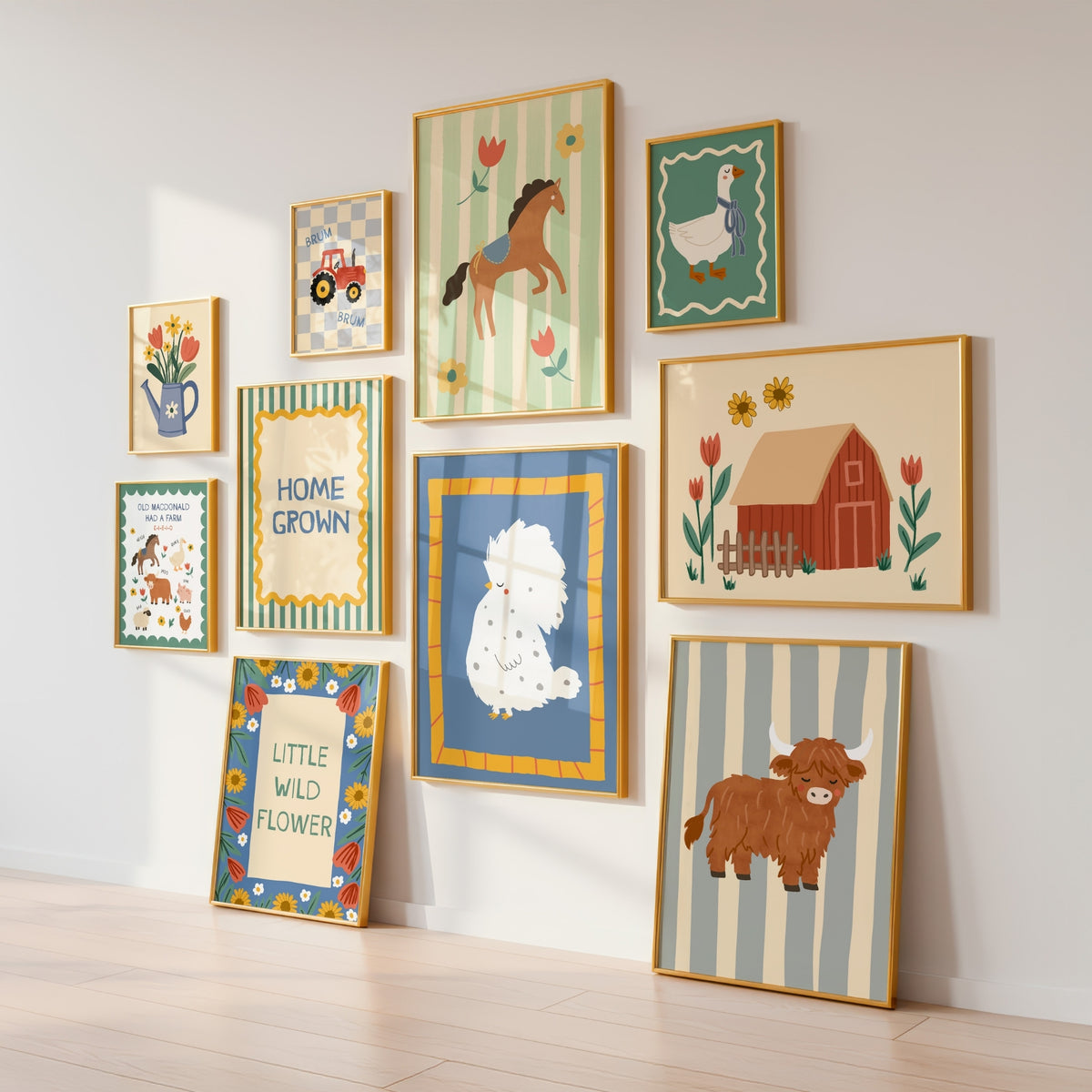 A gallery wall display of nine framed children's art prints with whimsical farm and nursery illustrations, arranged on a white wall above a light wood floor.
