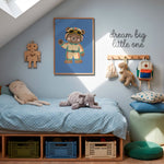 Racing bear print framed above kids bed with polka dot bedding, elephant plush and dream big little one wall sign