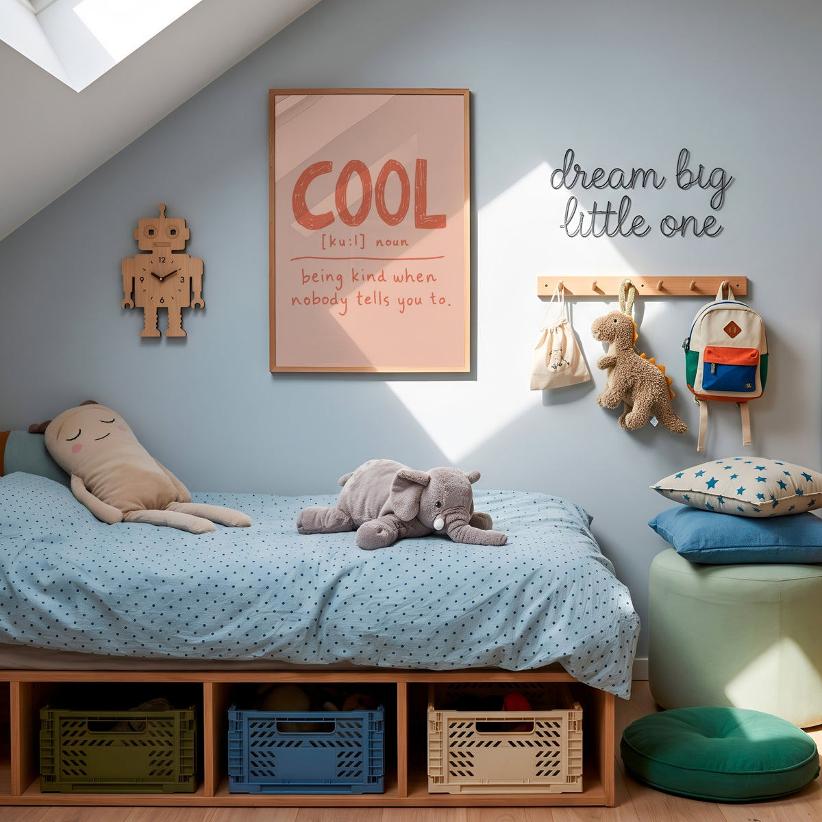 Cool definition print framed above kids bed with polka dot bedding, elephant plush and dream big little one sign