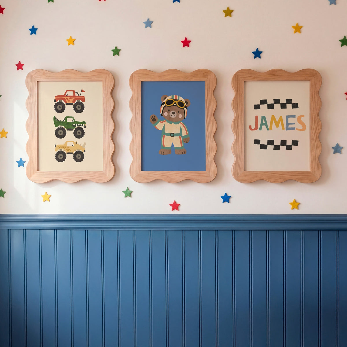 Three framed kids prints on star wallpaper: monster trucks trio, racing bear and custom name print with checkered borders