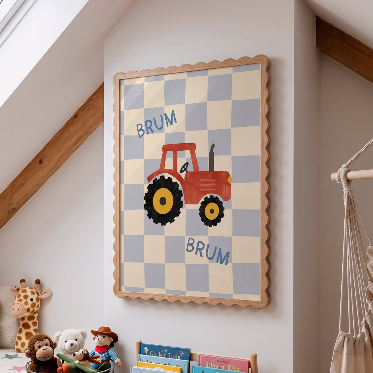 A framed children's wall art print hangs on a white wall in a nursery or playroom. The print shows a red tractor with yellow wheels on a blue and white checkerboard background, with the word 'BRUM' written in blue.