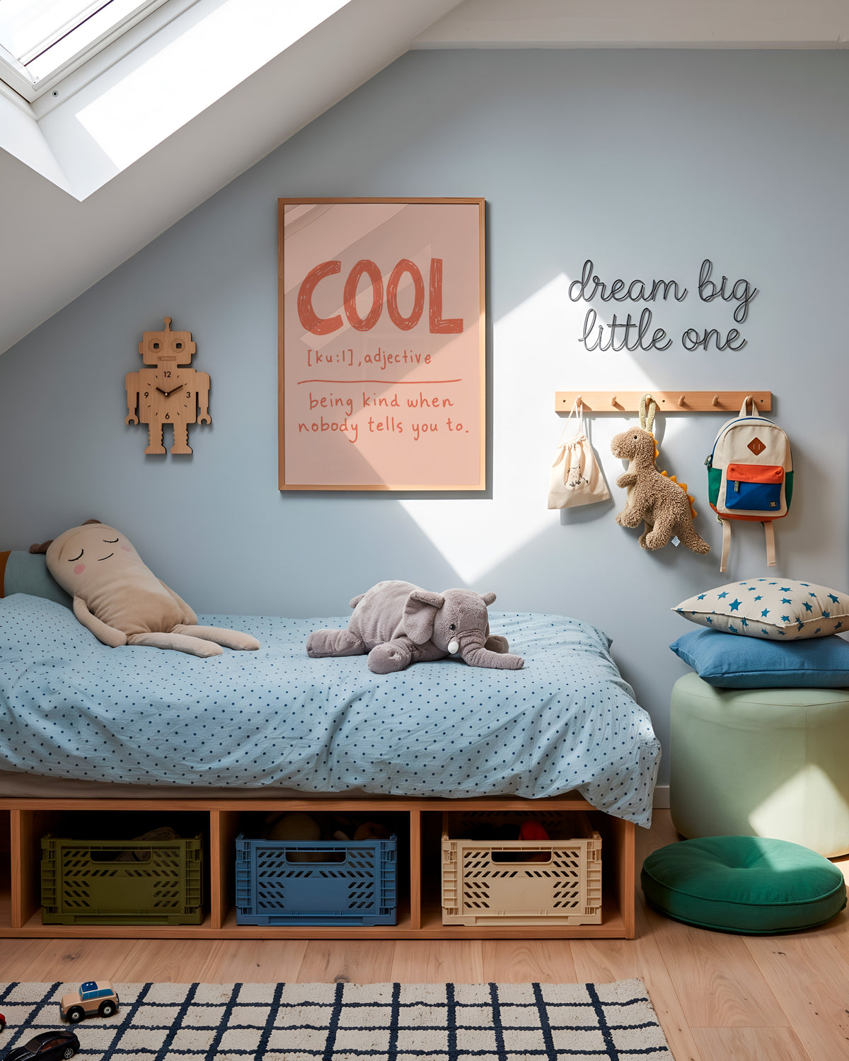 A styled children's bedroom corner with a low wooden bed, light blue bedding, stuffed toys, wall hooks, a framed 'COOL' poster, and a green stool under a slanted roof.