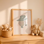 Framed Ballerina Hippo print styled in a nursery – hand-drawn ballerina hippo in a pink tutu on a candy-stripe background
