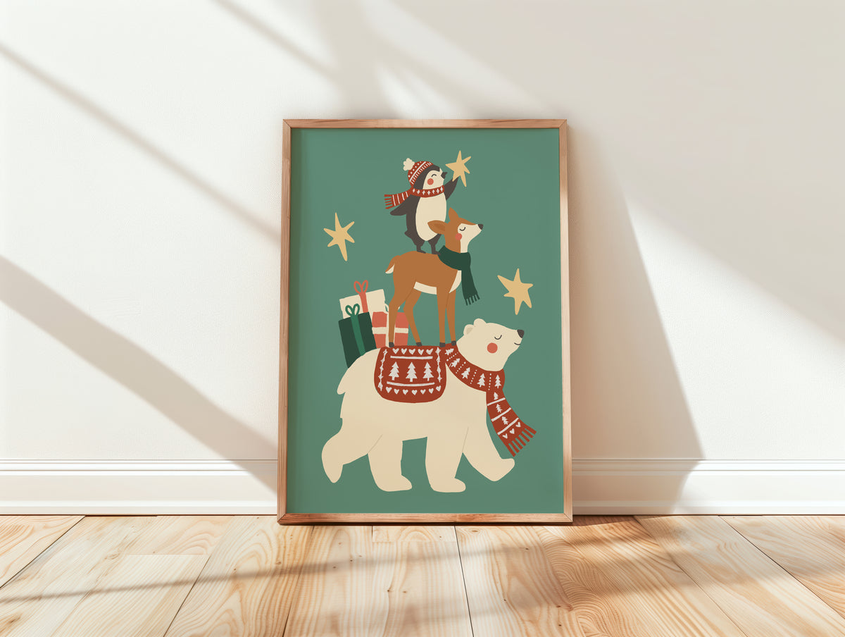 A framed art print leaning against a white wall on a light wood floor. The print shows a whimsical illustration of a polar bear wearing a red patterned scarf and carrying a deer on its back, with a penguin, stars, and gift bags on a muted teal background.